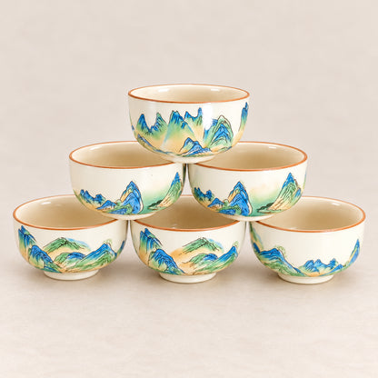 Six matching Qianli Jiangshan tea cups displayed together